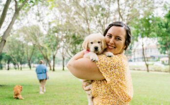 Woman holding Golden Retriever Puppy