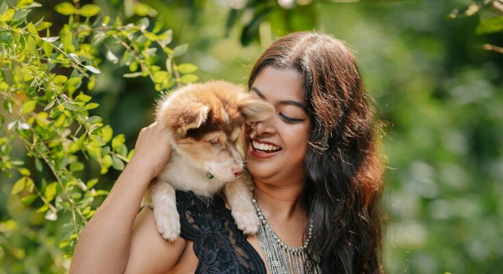 Woman and her Australian Shepherd Puppy