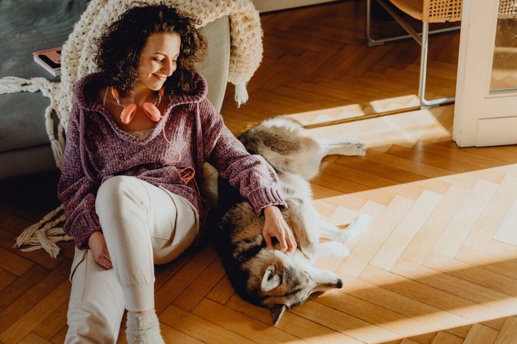 Relaxing with her Siberian Husky